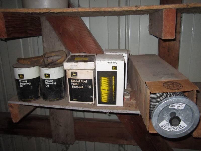lot 148 image: John Deere power steering fluid and...