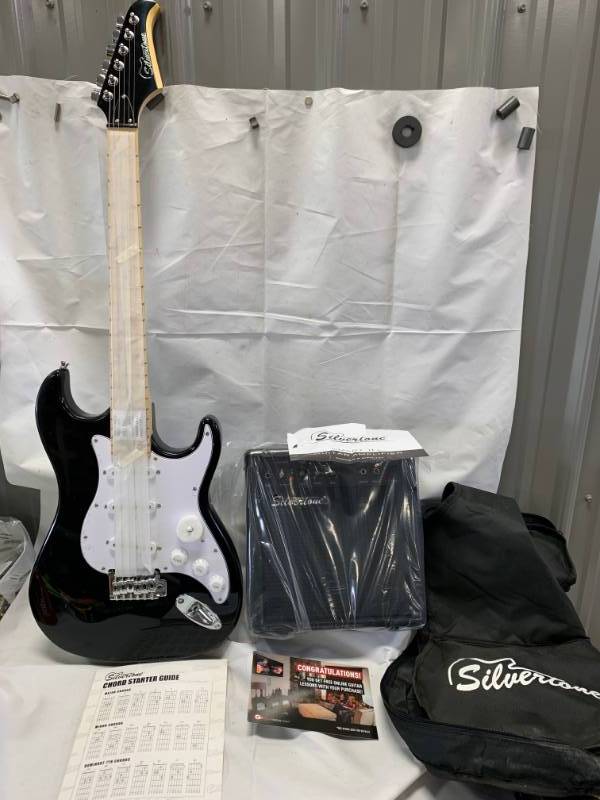 lot 37 image: Brand New Electric Guitar and Amplifier