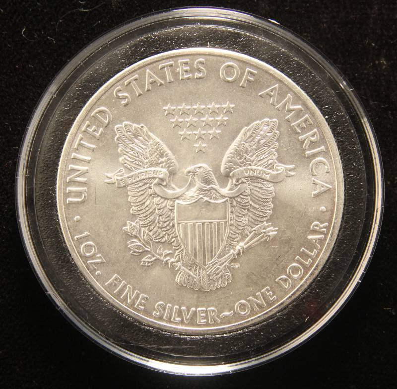 lot 13 image: 2011 AMERICAN SILVER EAGLE 1 TROY OZ. .999 FINE SILVER IN AIRTITE