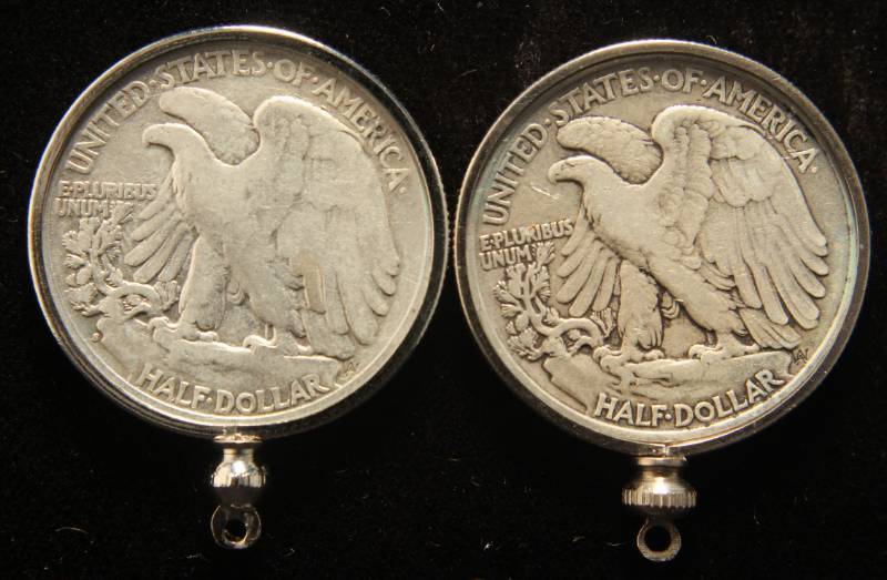 lot 21 image: 2 WALKING LIBERTY HALF DOLLARS IN BEZELS