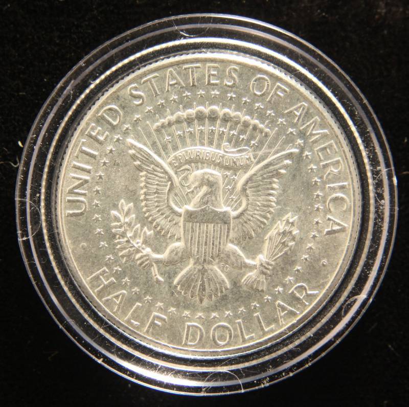 lot 37 image: 1964 KENNEDY HALF DOLLAR IN AIRTITE (looks better in hand than picture)