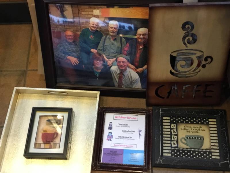 Various collection of coffee pictures and wall art.