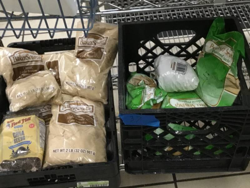 Food product on the shelf and 3 plastic crates