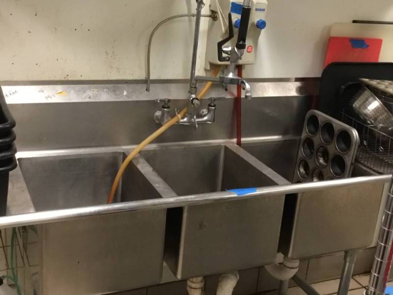 Stainless steel triple sink with dish sprayer and chem dispenser