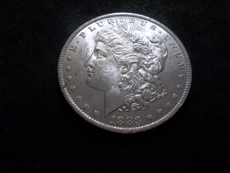 lot 21 image: 1883 O Morgan Silver Dollar