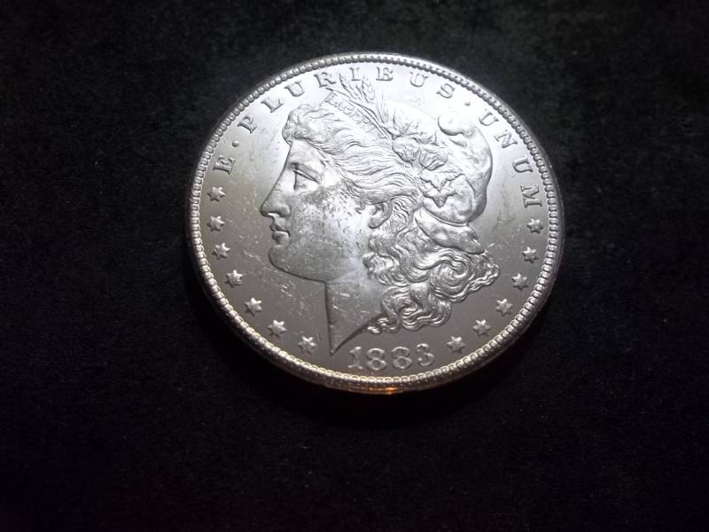 lot 23 image: 1883 CC Morgan Silver Dollar