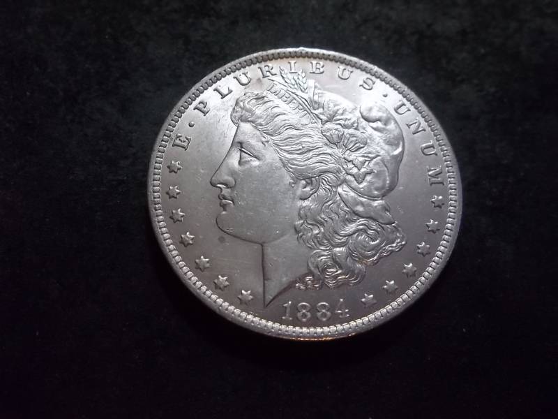 lot 25 image: 1884 O Morgan Silver Dollar