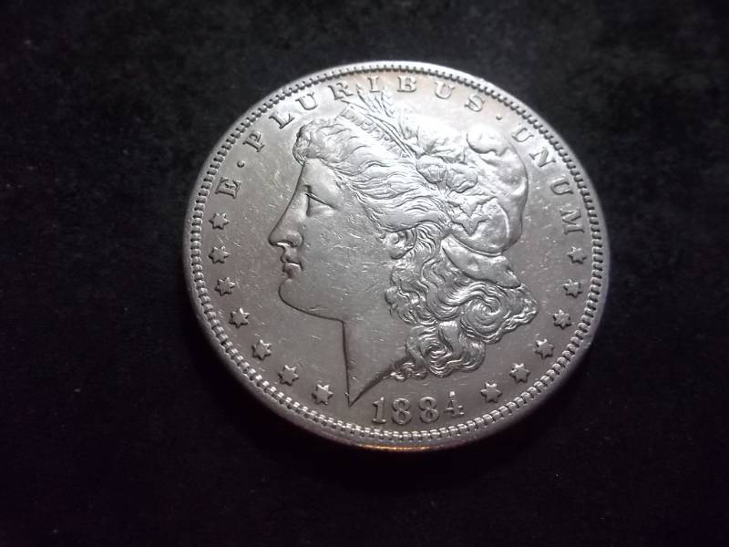 lot 26 image: 1884 S Morgan Silver Dollar