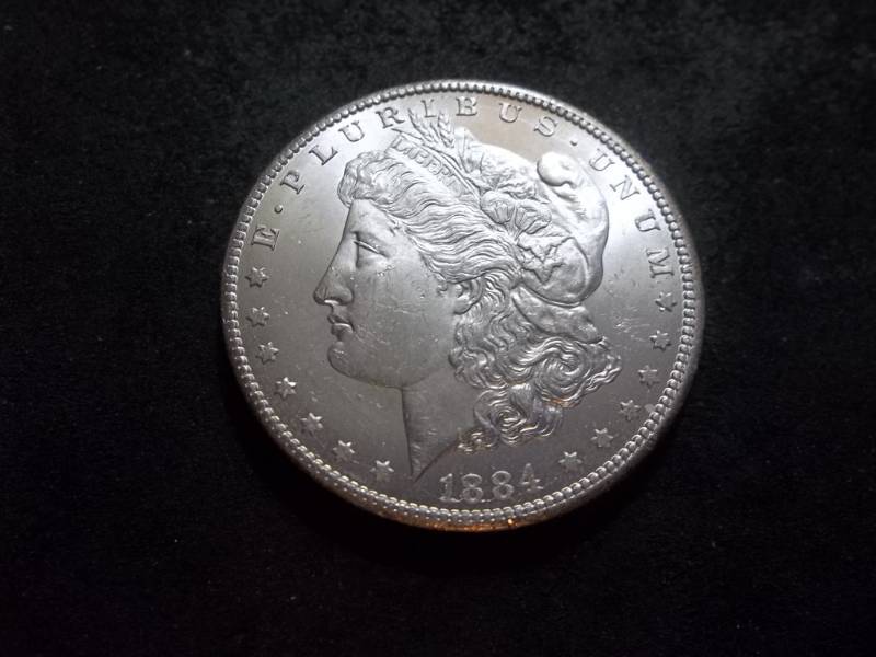 lot 27 image: 1884 CC Morgan Silver Dollar