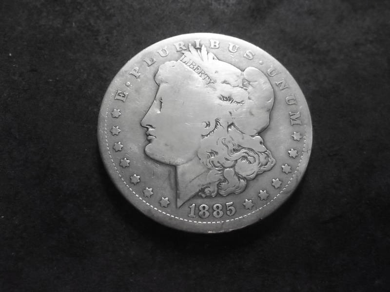 lot 31 image: 1885 CC Morgan Silver Dollar