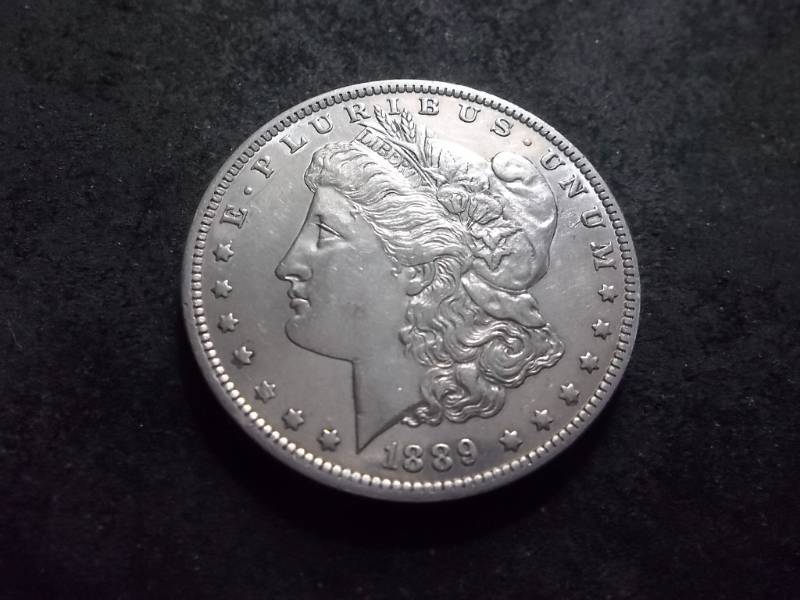 lot 42 image: 1889 O Morgan Silver Dollar