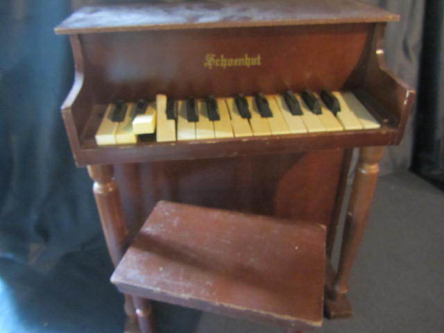 lot 28 image: Schoenut Toy Piano & Bench