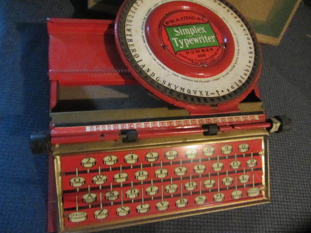 lot 21 image: Antique Simplex Toy Typewriter