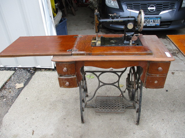 lot 148 image: Antique New Howard Sewing Machine