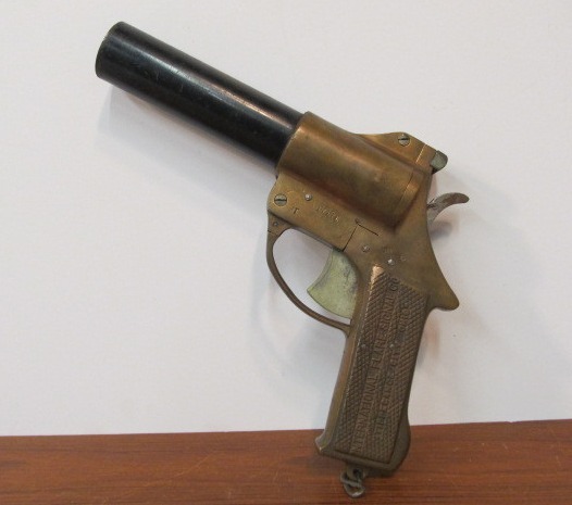 lot 212 image: Original Vintage 1943 Brass Flare Gun by The International Flare Signal Co.