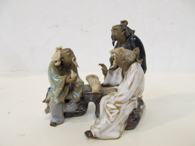 lot 311 image: Group of Vintage Japanese Mud Man Figurines Playing Games