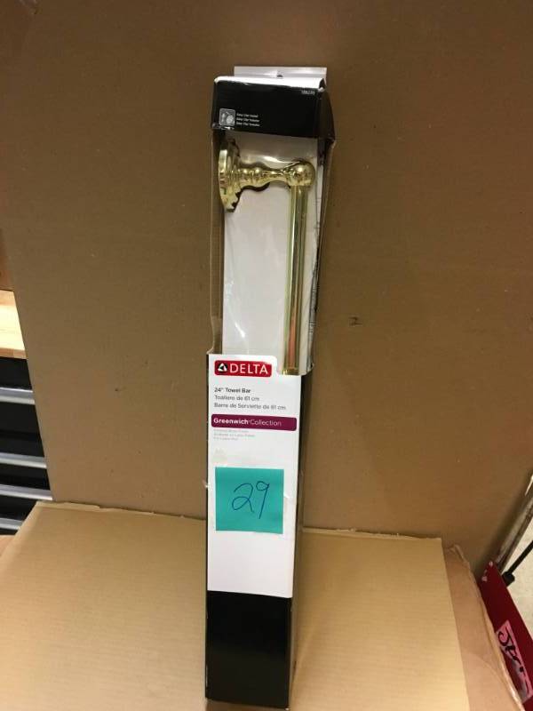 lot 29 image: Delta Greenwich 24 in. Towel Bar in Polished Brass 138270