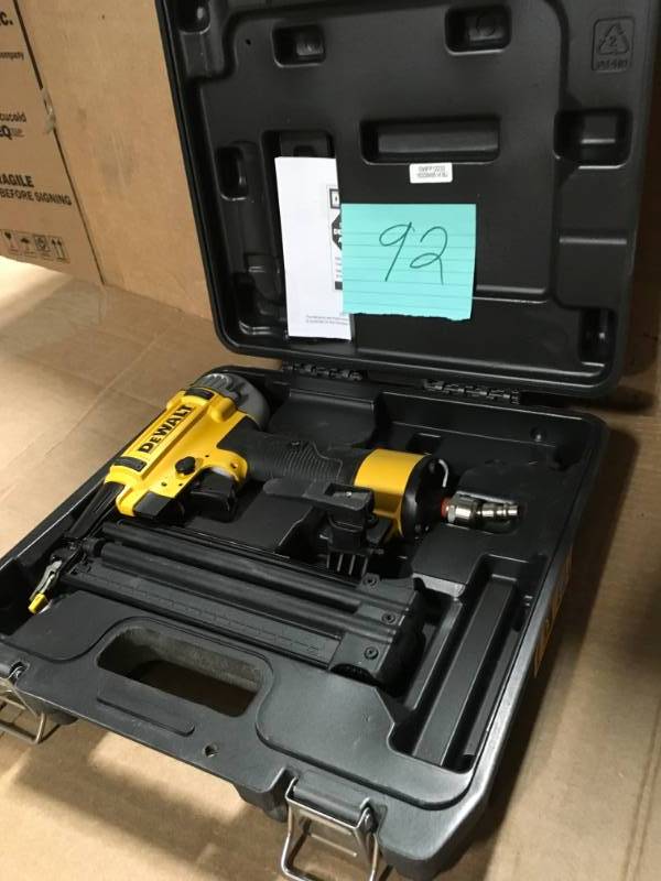 lot 92 image: DEWALT 18-Gauge Pneumatic Brad Nailer in good condition
