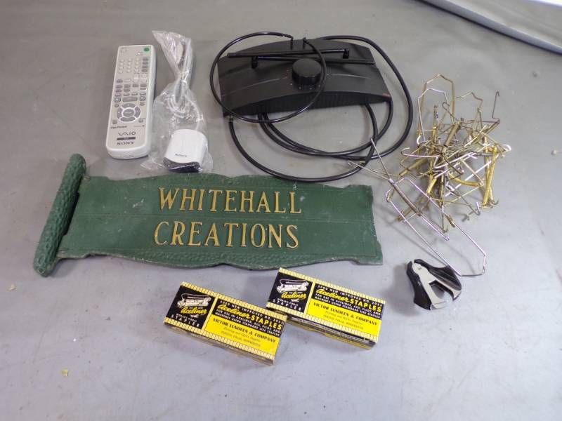 lot 94 image: Vintage Metal Sign, RCA Antenna, Sony remote, 11 wire plate hangers, etc.
