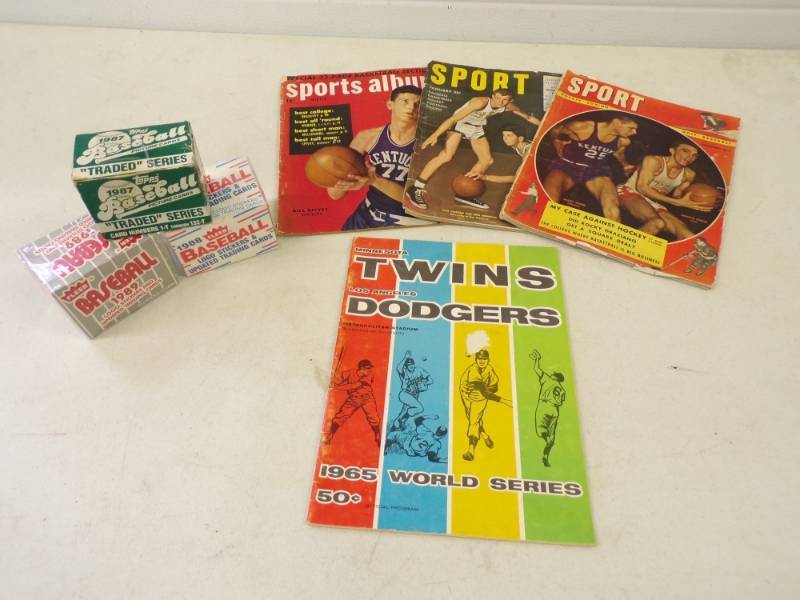 lot 61 image: 1965 Twins World Series Program, Vintage Basket Ball Magazines and Unopened Baseball Cards