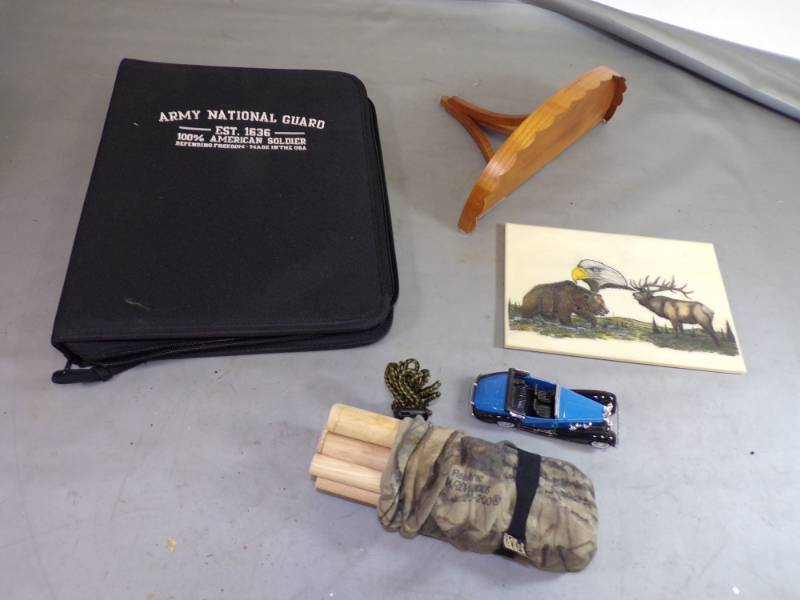lot 89 image: Realtree Hardwoods Deer Antler Deer Call, Army National Guard Portfolio, Wood Shelf, etc