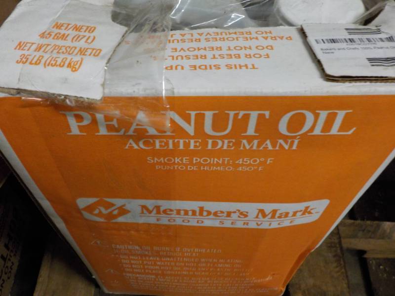 lot 107 image: 4.5 Gallon Peanut Oil past date...