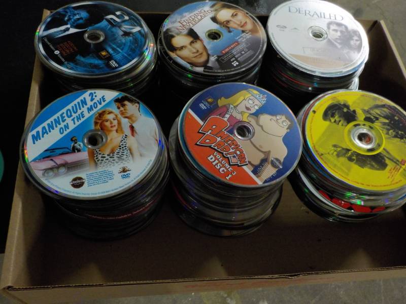lot 204 image: 300 or more DVDs, CDs and Games...