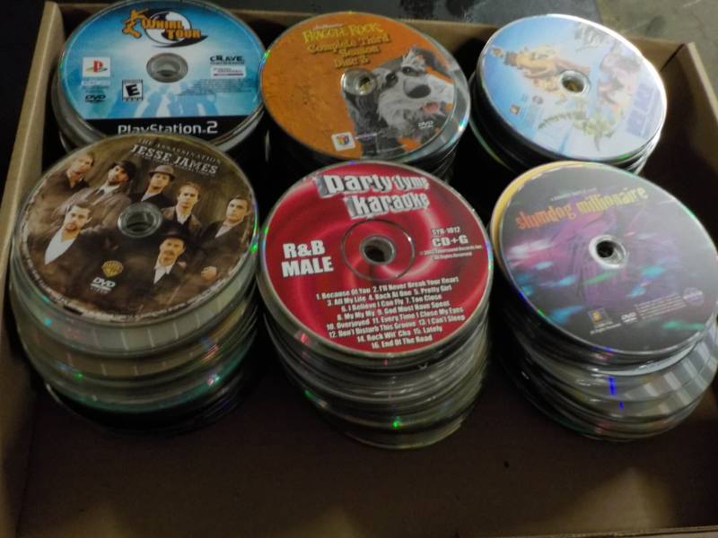 lot 205 image: 300 or more DVDs, CDs and Games...