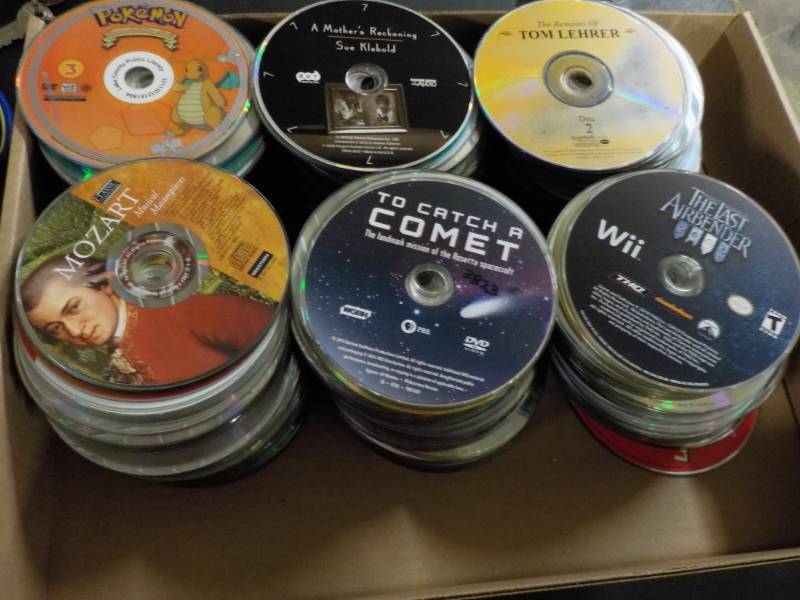 lot 207 image: 300 or more DVDs, CDs and Games...