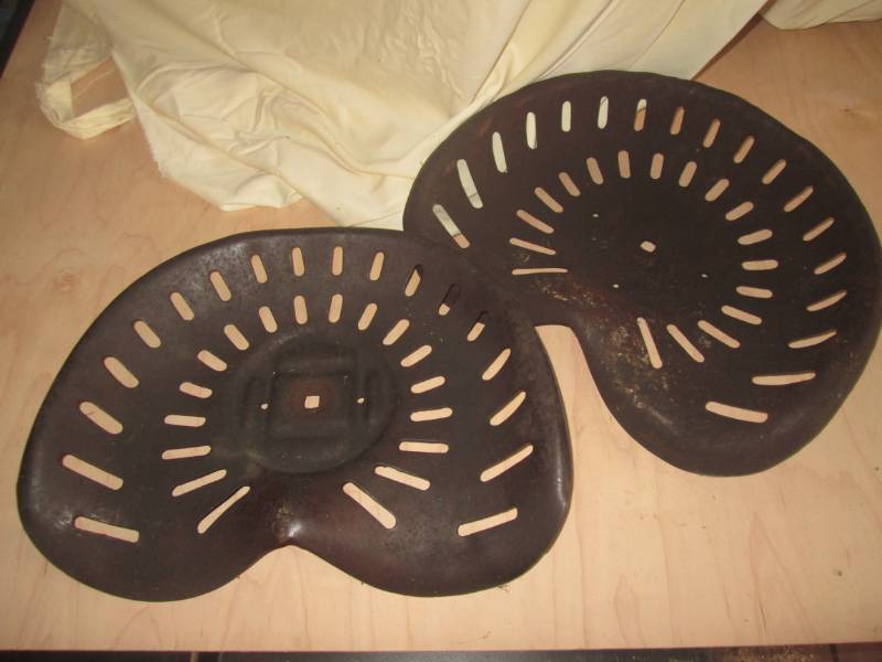 lot 21 image: 2 Metal tractor seats...