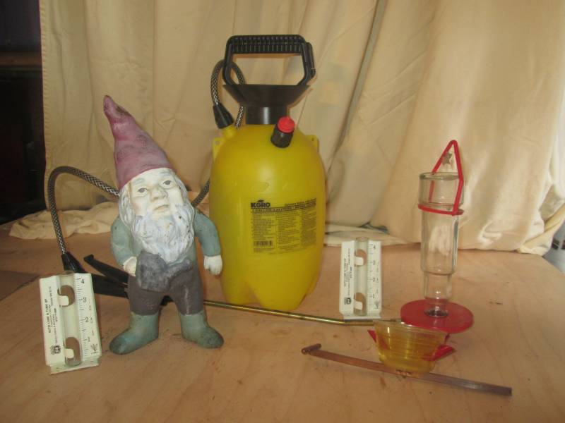 lot 68 image: Sprayer, gnome and hummingbird feed...