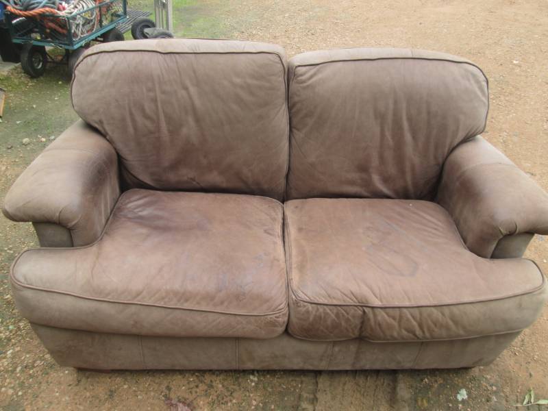 lot 93 image: Leather couch, approx. 63 wide...