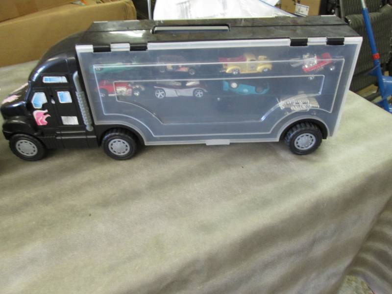 lot 141 image: Toy Semi Car Carrier with Vehicles...