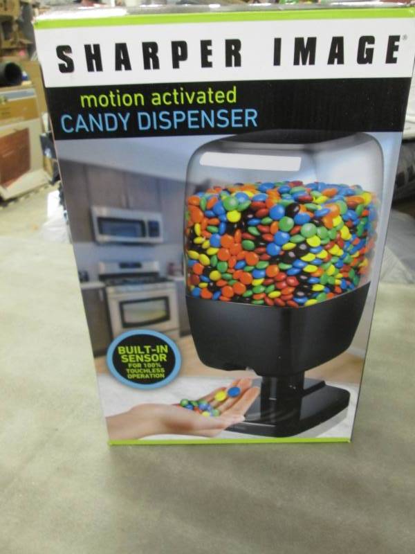 lot 236 image: Sharper Image Candy Dispenser...