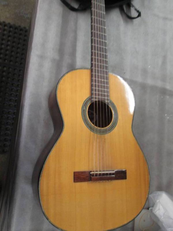 lot 255 image: Guitar with case...