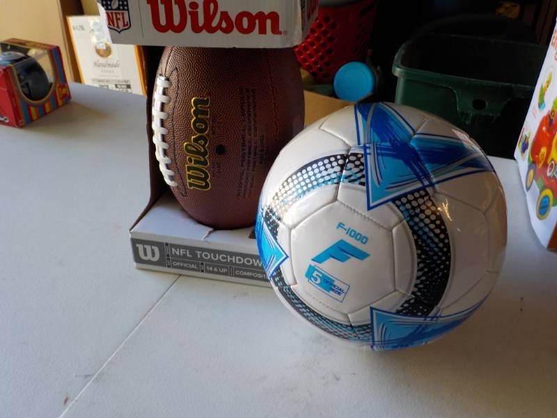 lot 116 image: New Wilson Football and Volleyball...