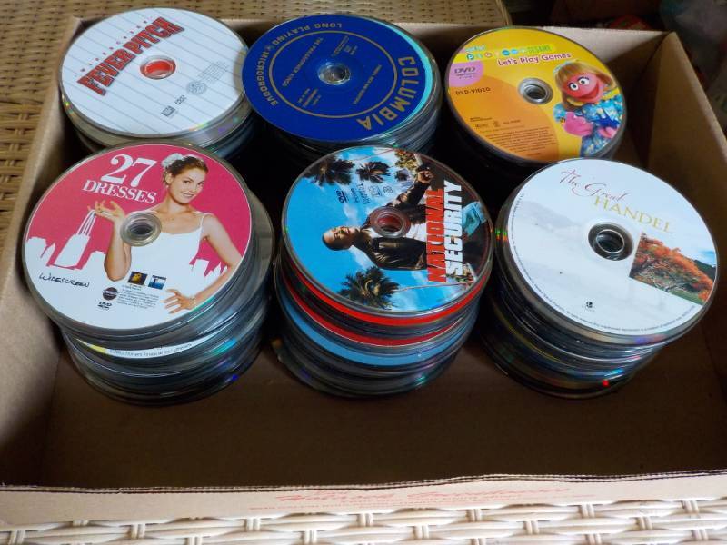 lot 153 image: 300 or more DVDs, CDs, and Games...