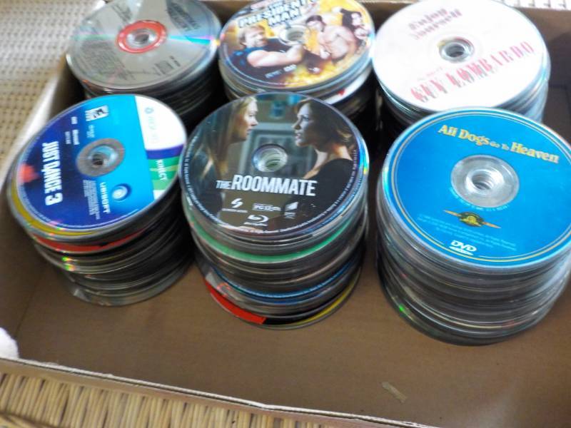 lot 154 image: 300 or more DVDs, CDs, and Games...