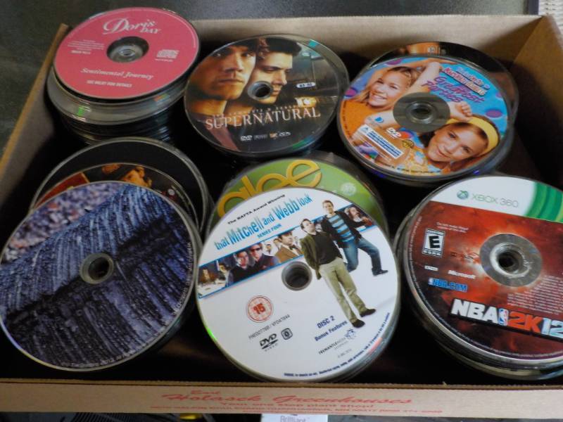 lot 157 image: 300 or more DVDs, CDs, and Games...