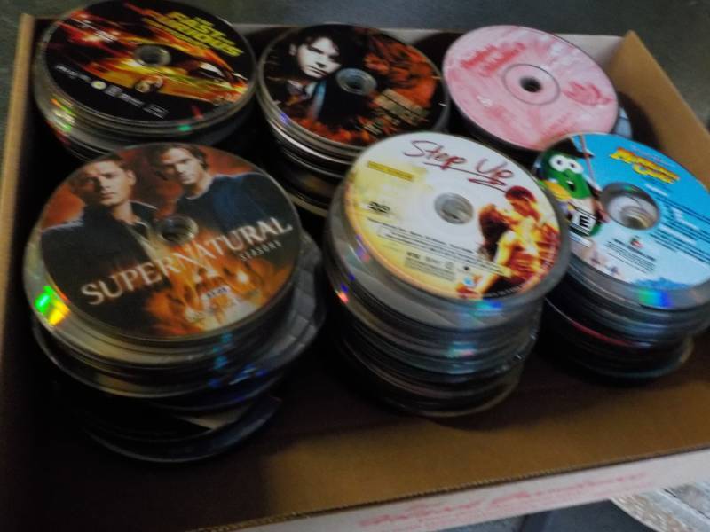 lot 162 image: 300 or more DVDs, CDs, and Games...