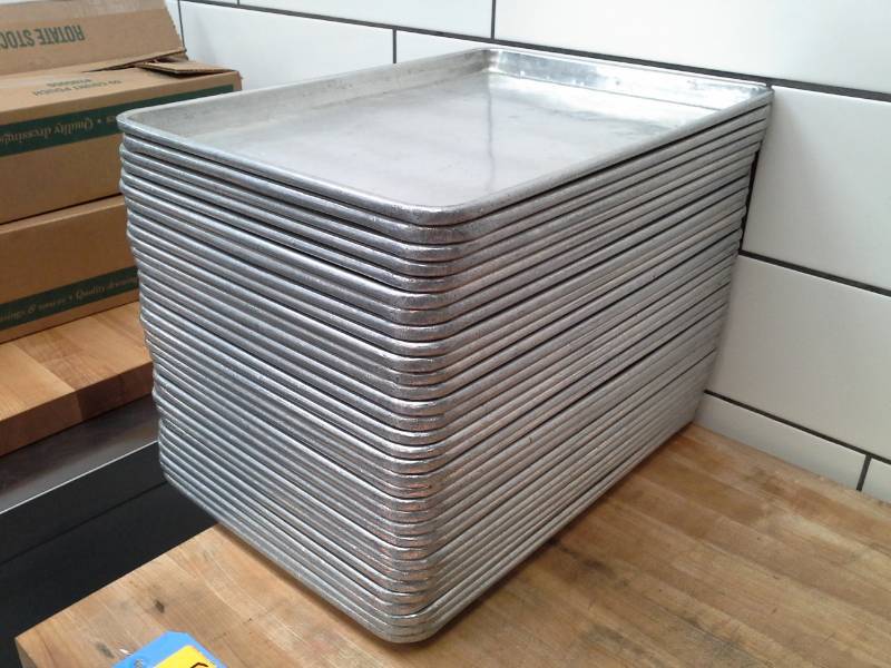 lot 132 image: Lot of (Approximately 35) 13x18in. Cooking Sheets
