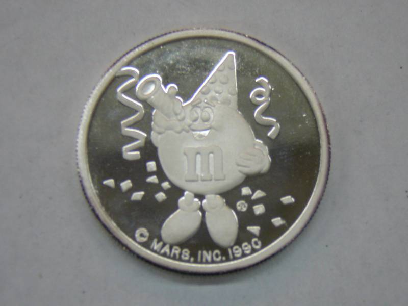 lot 18 image: 50th Birthday M & Ms Chocolate Candies 1940-1990 Coin