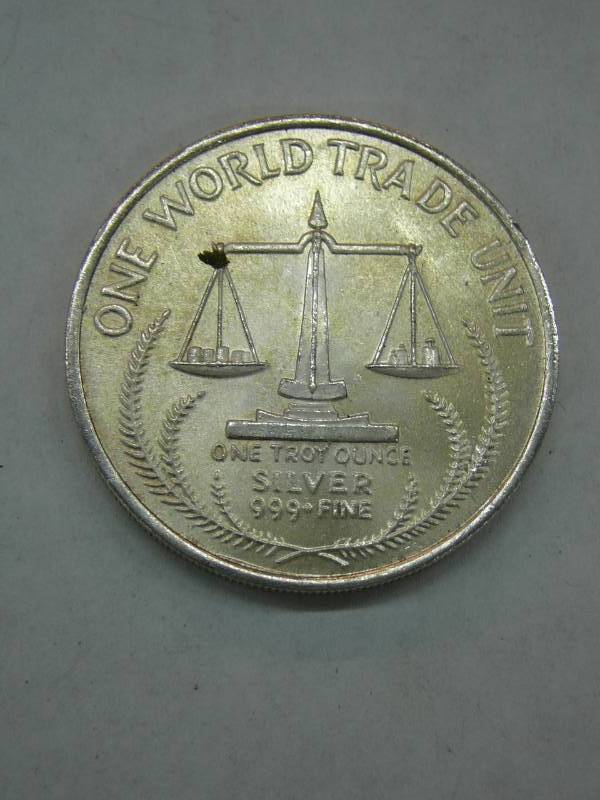 lot 65 image: 1985 World Trade One Troy Ounce .999 Fine Silver