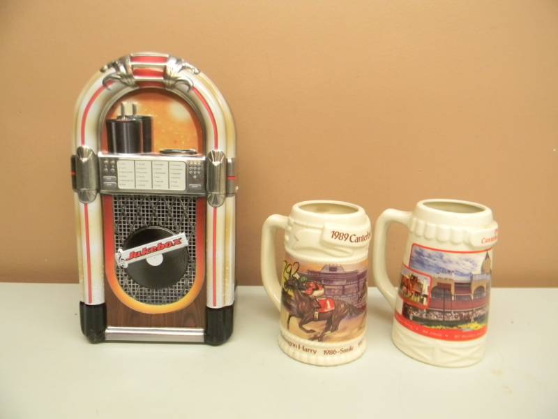 lot 27 image: 2 CANTERBURY BEER STEINS & TINMETAL JUKE BOX - SEE PICTURES