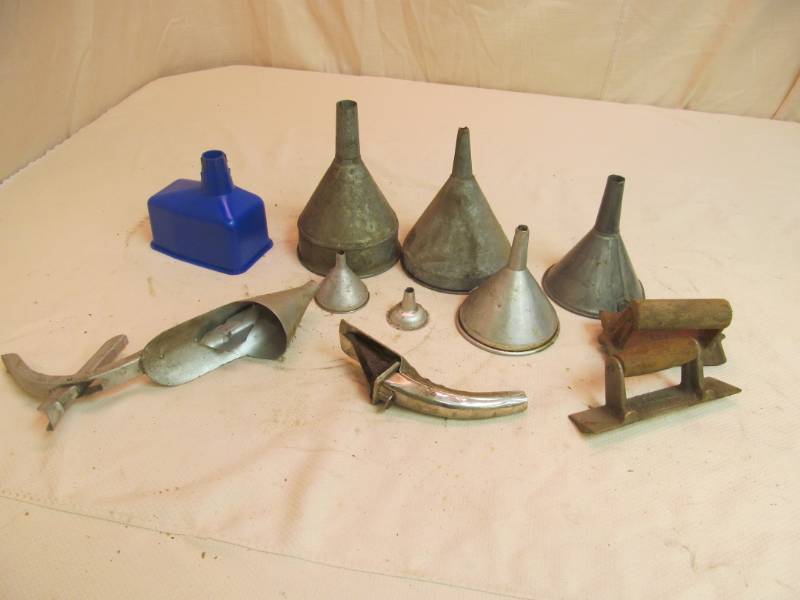 Variety of funnels, oil can spouts, 2 mason tools