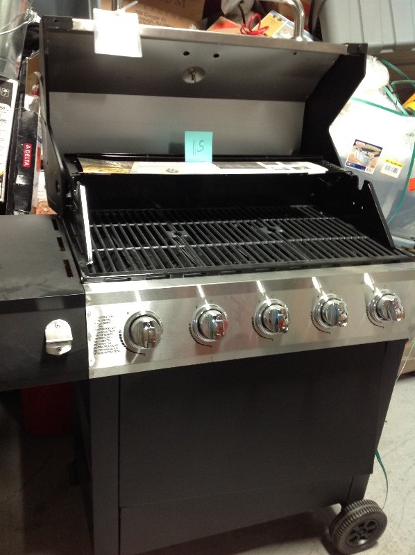 lot 115 image: Dyna-Glo 5-Burner Open Cart LP Gas Grill in Stainless Steel and Black with Side Burner whit damage please review the pictures in working conditions