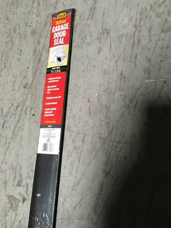 lot 64 image: M-D Building Products 1-58 in. x 9 ft. Aluminum and Vinyl Garage Door Bottom  in good condition
