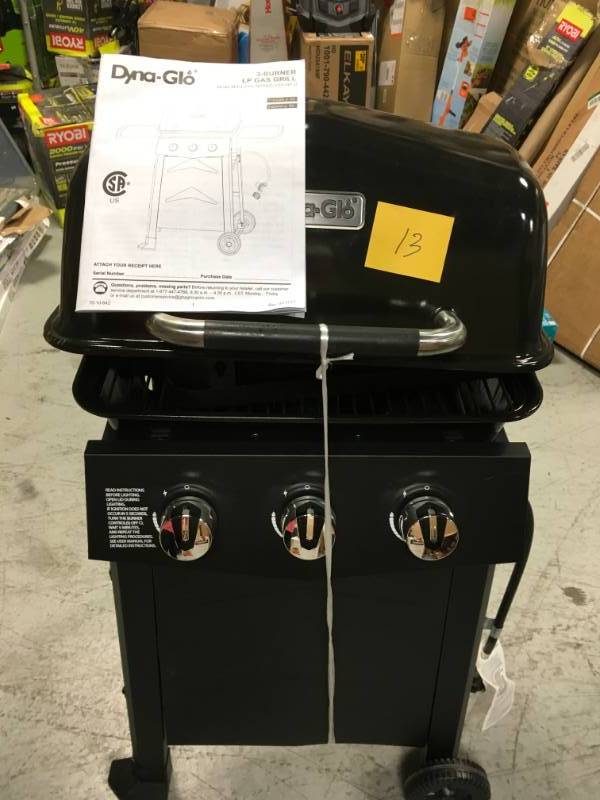 lot 13 image: Dyna-Glo 3-Burner Open Cart Propane Gas Grill in Black in good condition