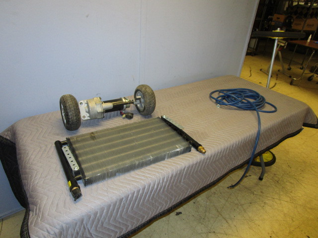 lot 412 image: RADIATOR, ELECTRIC MOTOR WWHEELS, AND WHEELS WAXLE