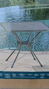 lot 145 image: Mesh Bistro Table and 3 Chair Set. Minor Damage